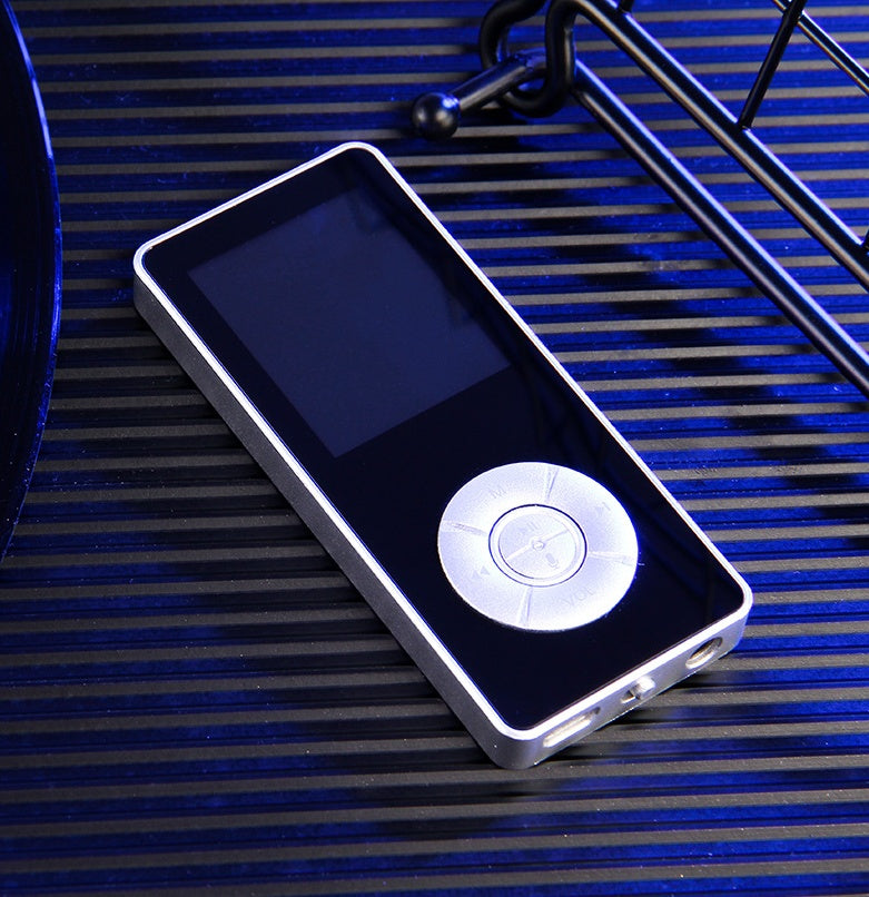 A portable media player with a matte black body, on-screen icons indicating music, video, radio, and other functions, and a microSD card slot.