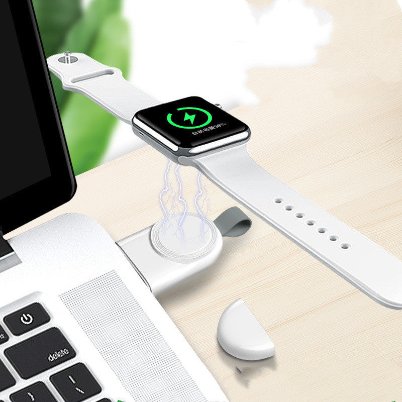 A white wireless charger mounted on a wall, charging a white Apple Watch.