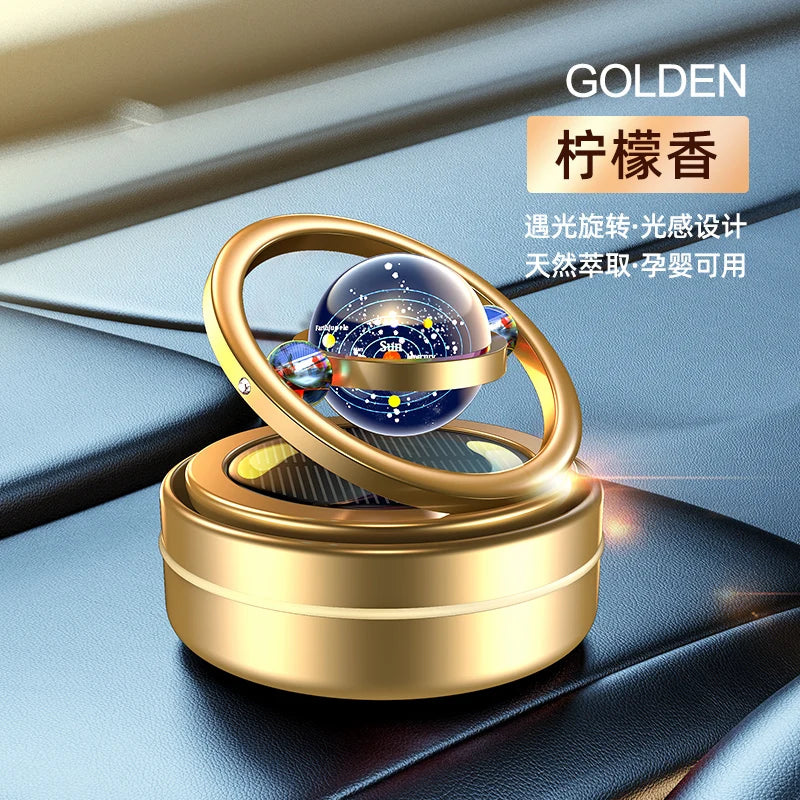 A car oil diffuser with a solar system theme, featuring a rotating globe on top, Golden.