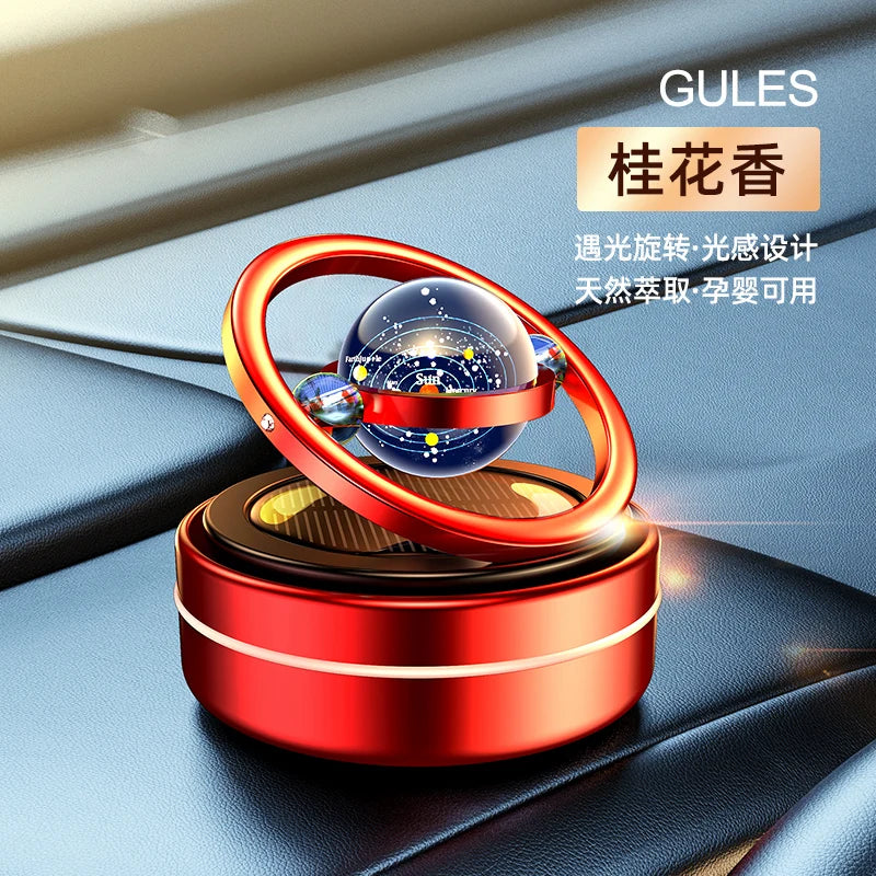 A car oil diffuser with a solar system theme, featuring a rotating globe on top, Gules.