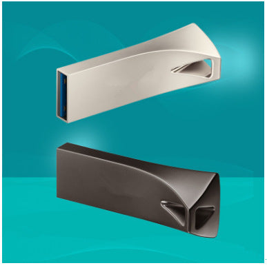 Two triangle-shaped USB flash drives, one silver and one black, against a blue background.