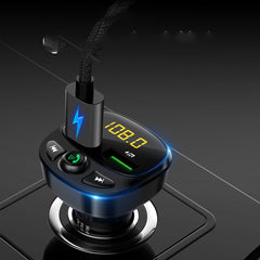 A black car MP3 player with a digital display, buttons for navigation and functions, and a USB port.