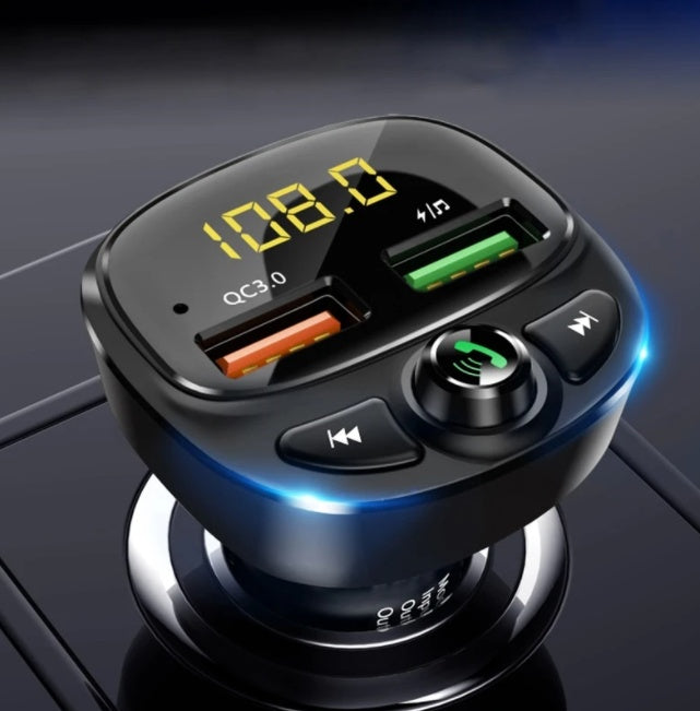 A black car MP3 player with a digital display, buttons for navigation and functions, and a USB port.