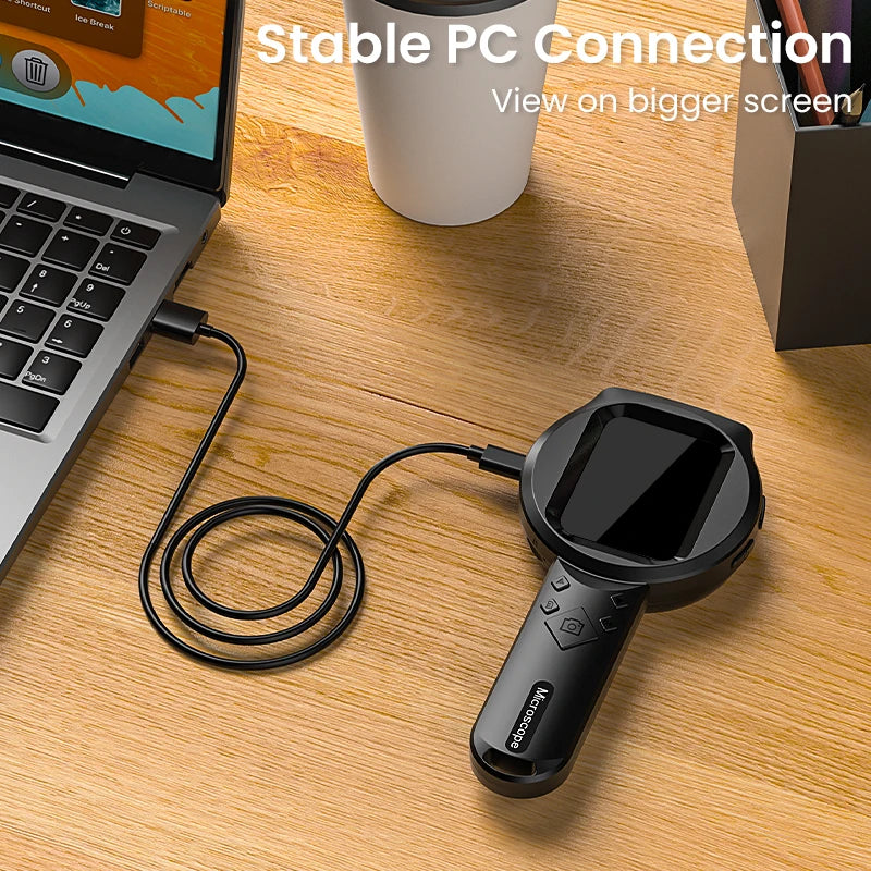 Handheld scanner connected to a laptop on a wooden desk with text 'Stable PC Connection'.