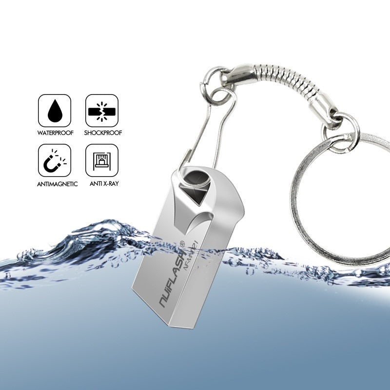 A mini size USB flash drive with black and silver color scheme.