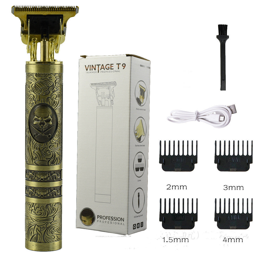 A Gold-colored hair trimmer with an ornate design, along with several attachment combs and a charging cable. The product is packaged in a box that features the name 'Vintage T9'.