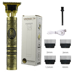 A Gold-colored hair trimmer with an ornate design, along with several attachment combs and a charging cable. The product is packaged in a box that features the name 'Vintage T9'.