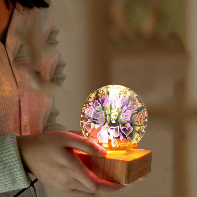 A LED nightlight with a design resembling fireworks displayed on a spherical lampshade.