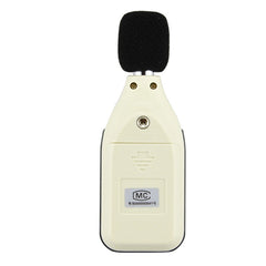A handheld digital sound level meter with a black microphone cover, buttons, and a digital display showing a reading.