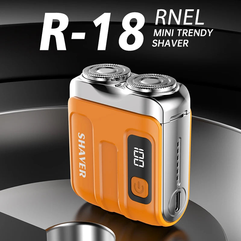 Orange and silver R-18 RNEL mini trendy shaver on a reflective surface with a black background