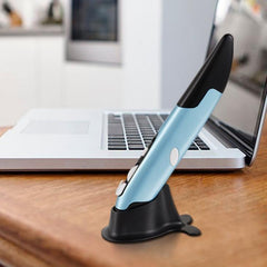 Blue stylus on a black stand in front of an open laptop on a desk