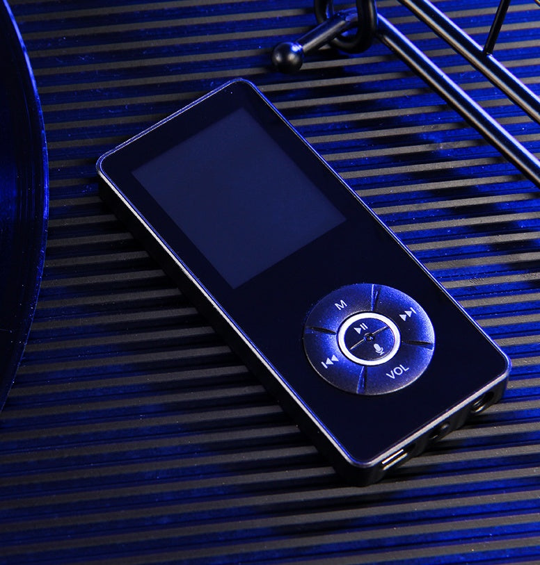 A portable media player with a matte black body, on-screen icons indicating music, video, radio, and other functions, and a microSD card slot.
