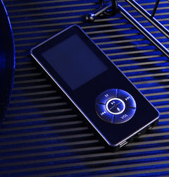 A portable media player with a matte black body, on-screen icons indicating music, video, radio, and other functions, and a microSD card slot.