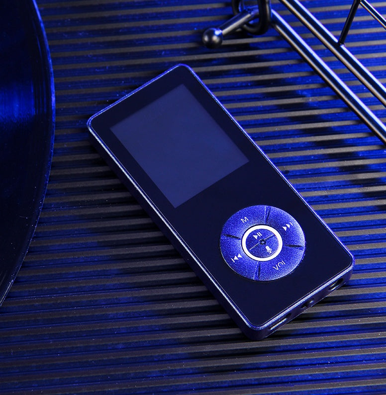 A portable media player with a matte black body, on-screen icons indicating music, video, radio, and other functions, and a microSD card slot.