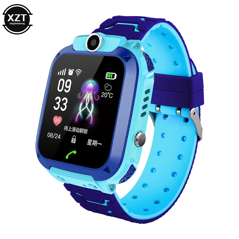 Two children's smart watches, one in pink and one in blue, with a silicone band and a square touchscreen display.