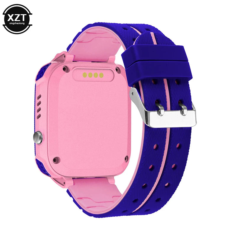 Two children's smart watches, one in pink and one in blue, with a silicone band and a square touchscreen display.
