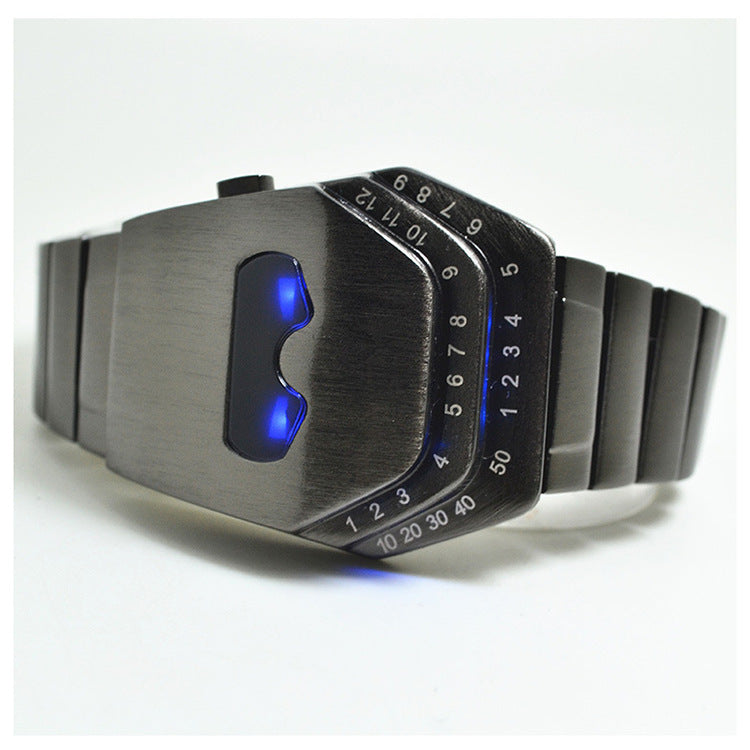 A digital men's watch with a blue-lit number display, alloy strap, and diamond-shaped dial.