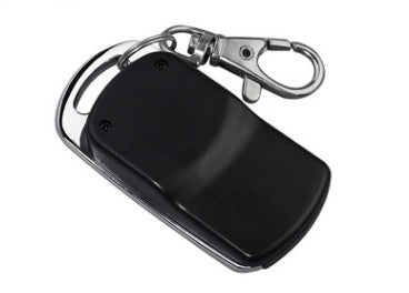 A black universal multi-programmable remote control with four buttons and a keychain.