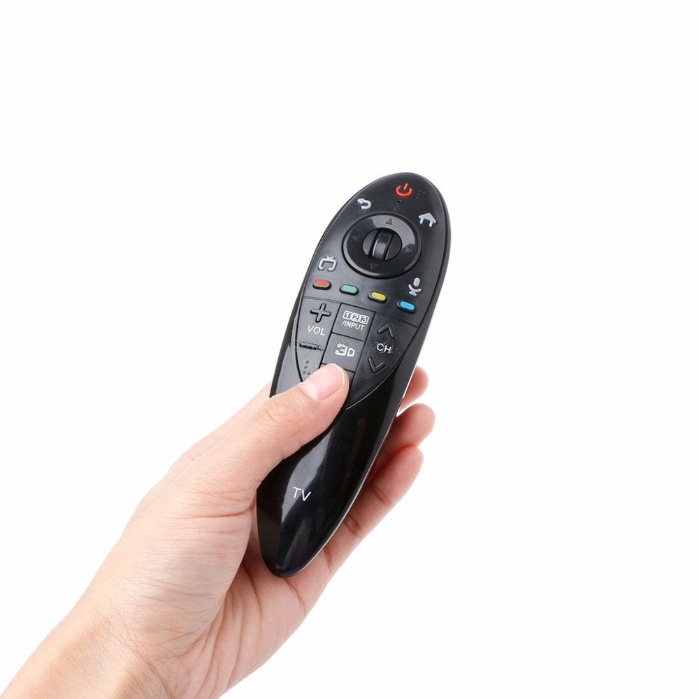 A person holding a black universal remote control.