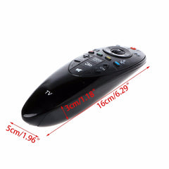 A person holding a black universal remote control.