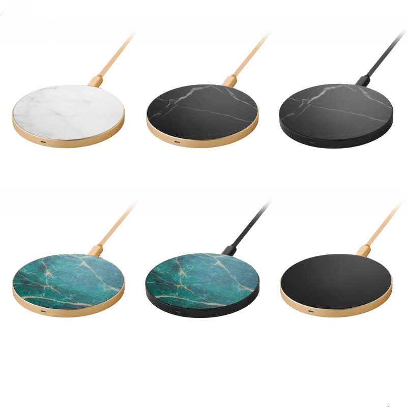 A collection of wireless chargers with a circular design, available in white, black, and green colors, with a marble pattern and a gold edge.